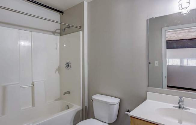 a bathroom with a sink toilet and a shower
