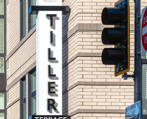 a traffic light and a sign on the side of a building
