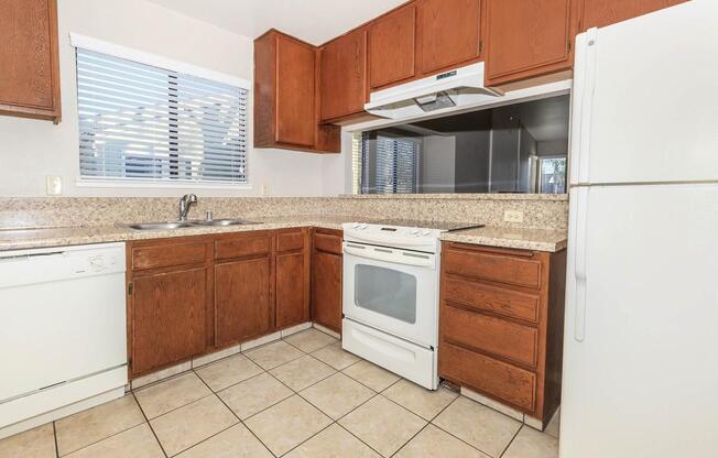 a kitchen with a refrigerator stove and microwave