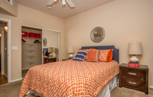 Bedroom with cozy bed and ceiling fan at The Belmont by Picerne, Las Vegas