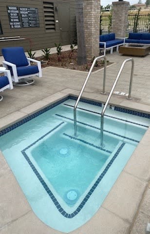 a small swimming pool with a stainless steel hand railat Westbury Apartments, Rancho Cucamonga, California