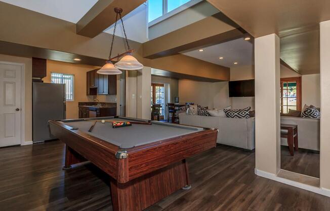 a kitchen with wooden cabinets and a wood floor