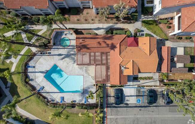 arial view of a house with a swimming pool in the yard