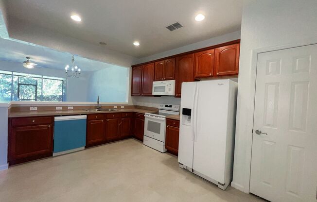 ALL NEW FLOORING(NO CARPET)! FRESH PAINT! NEW STOVE! NEW DISHWASHER! NEW DRYER!! MAN GATED SPRING ISLE COMMUNITY! 1 CAR GARAGE ATTACHED!