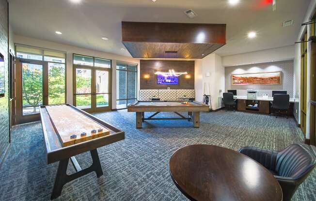 a game room with a ping pong table and a pool table