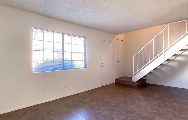 Great 3 bedroom and 1.5 bath townhouse with a small yard and 2 car garage.