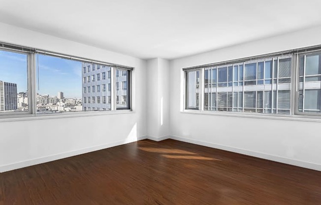 an empty room with three windows