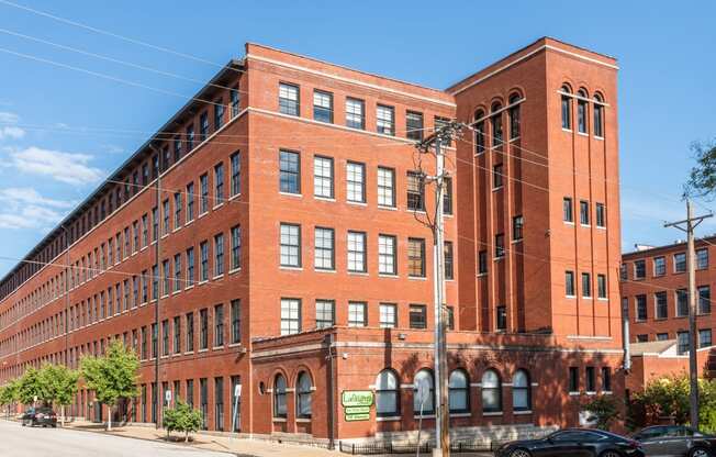 a large red brick building on a city street