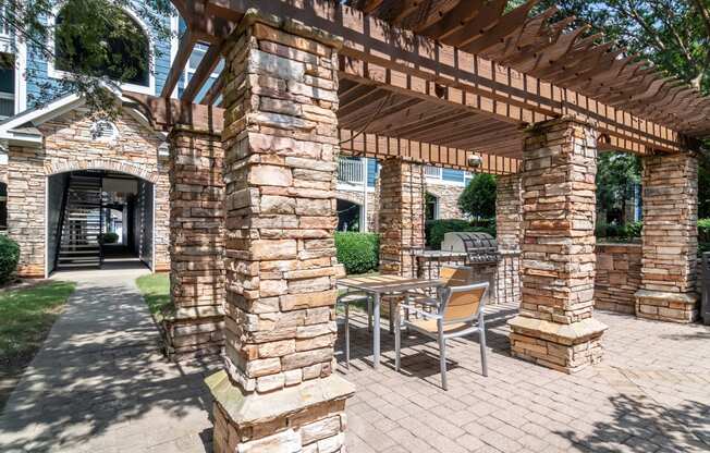 Lea Woodstock apartments in Woodstock, Georgia photo of pool deck table and chairs