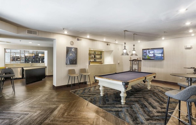 furnished clubroom with pool table in apartment building