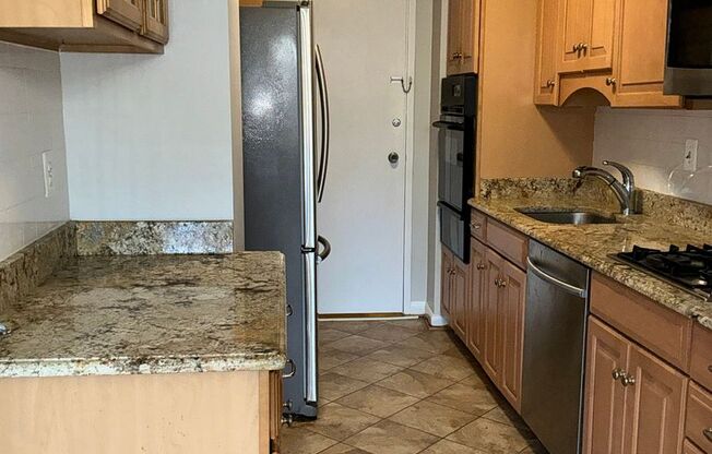 Luxury 2-bedroom 2-bath condo in Grosvenor Park with 1 reserved garage parking space.