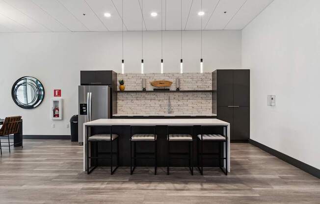 A kitchen with a white brick wall and a marble countertop.