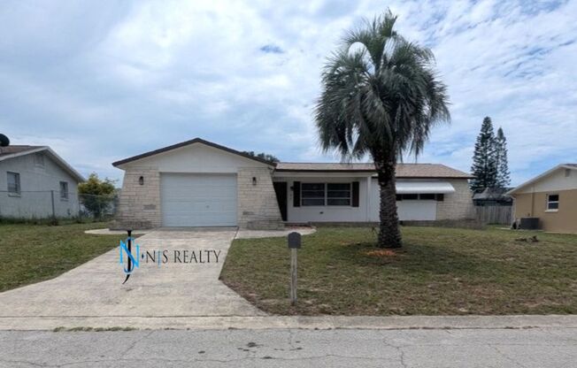 Large open 2/2/1 1378 Sq. Ft. with freshly finished floors, fresh paint, new appliances and located near the heart of Downtown New Port Richey!!