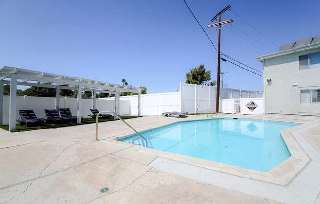 Gated pool with lounging area at Cedar Glen.