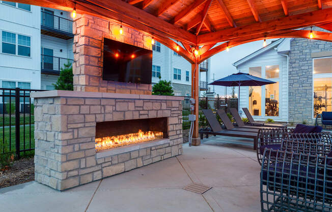 our outdoor fireplace is the focal point of our patio  at The Edison at Tiffany Springs, Missouri, 64153