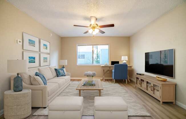 a furnished living room with a ceiling fan at Lago Bello Apartment