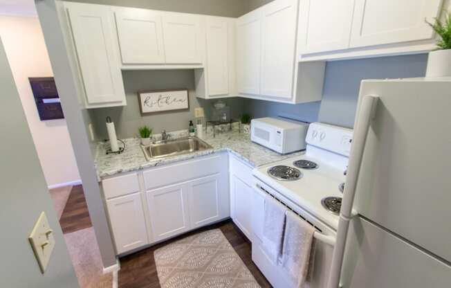 This is a picture of the kitchen in a 549 square foot 1 bedroom, 1 bath apartment at Romaine Court Apartments in the Oakley neighborhood of Cincinnati, Ohio.