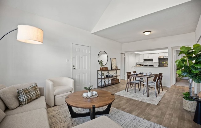 A living room with a couch, chair, and coffee table.