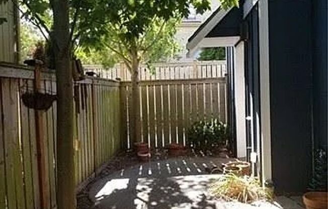 Spacious 4 Bedroom Townhome with Private Fenced Yard!