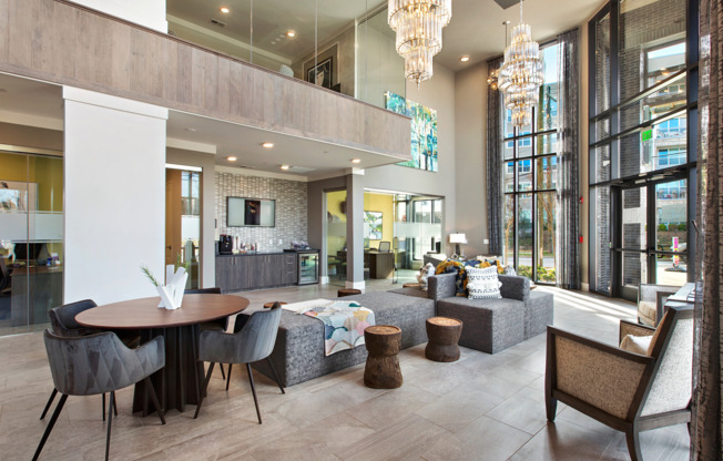 Lounge and lobby at our apartments in Atlanta, featuring stone floor paneling, couches, and elegant decor.