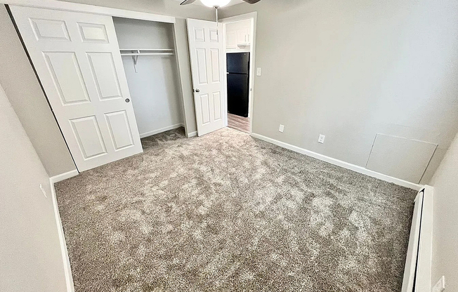Experience comfort and style in this spacious bedroom, tailored for relaxation.