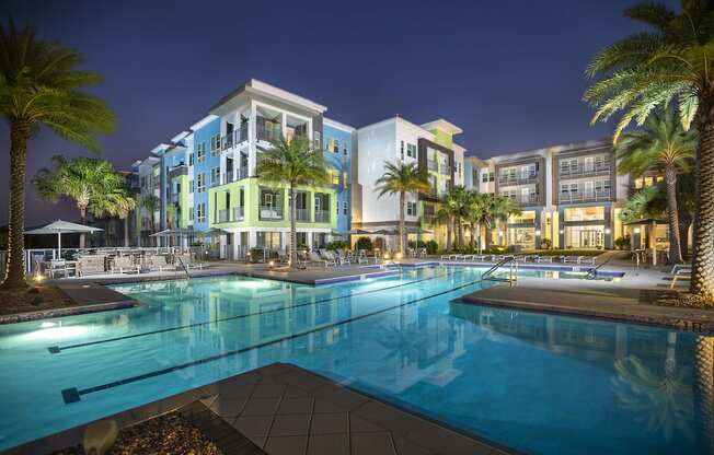 Luxury, resort-style, olympic-sized pool at night at Residences at The Green Apartments for rent