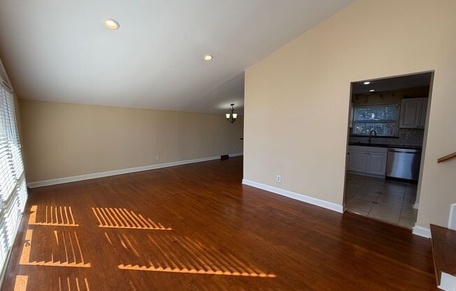 Freshly Painted Split-Level Home with Large Deck & Lawn Care Included