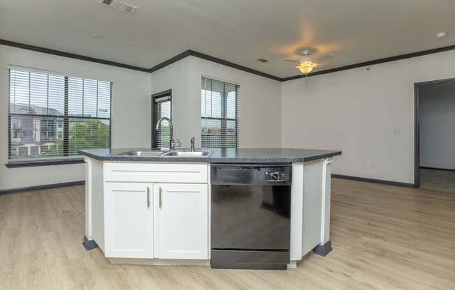 a kitchen with an island and a large window