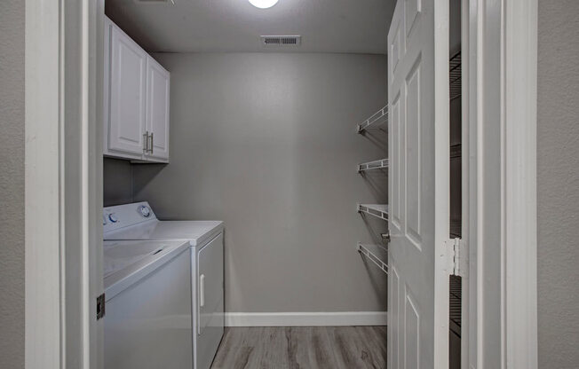 a laundry room with a washer and dryer