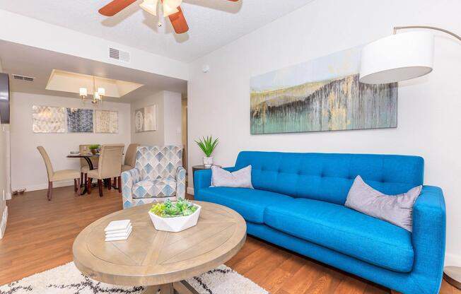 a living room filled with furniture and a large window