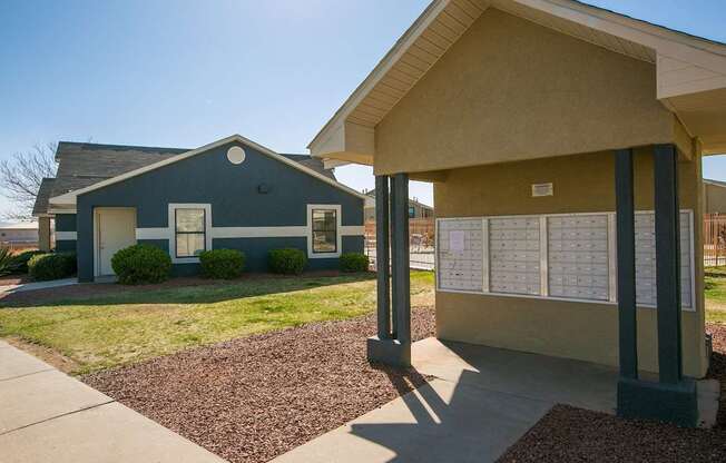 A small building with a blue house in front of it.