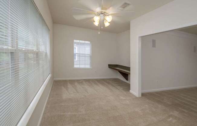 A room with a window and a bench.