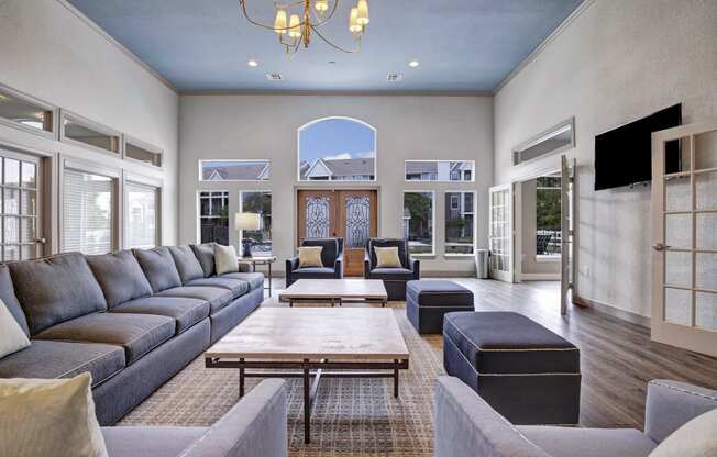 Resident lounge with couches and chairs and a table Apartments for rent Springdale AR