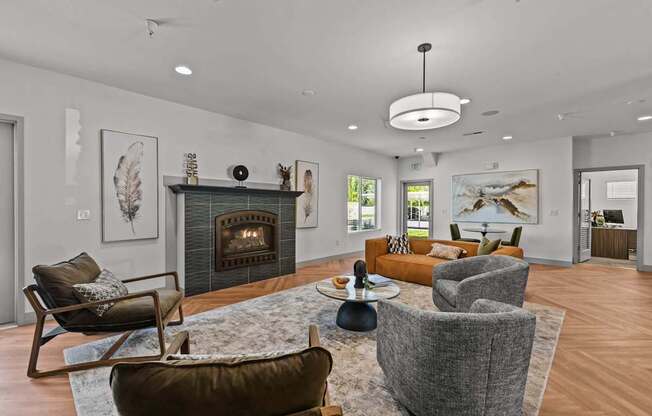 A modern living room with a fireplace and comfortable seating.