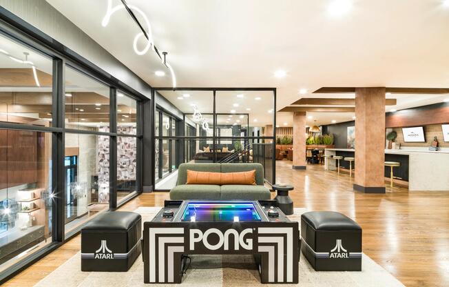 A stylish indoor lounge at Modera Higley Commons, where curated amenities and playful details create a welcoming place to unwind and connect.