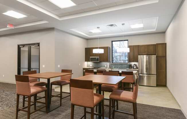 Montreal Courts Apartments in Little Canada, MN | Community Room Kitchen & Dining Area