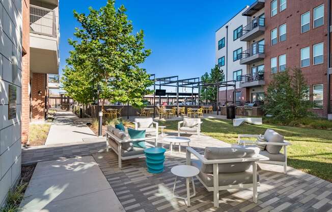Outdoor Lounge Area and Tables with BBQ Grills