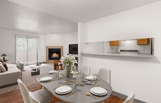 a dining area with a table and chairs and a fireplace in the background