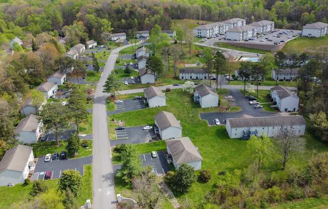 an aerial view of a neighborhood with houses and trees