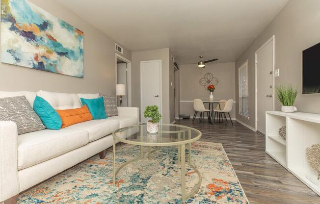 a living room filled with furniture and a rug