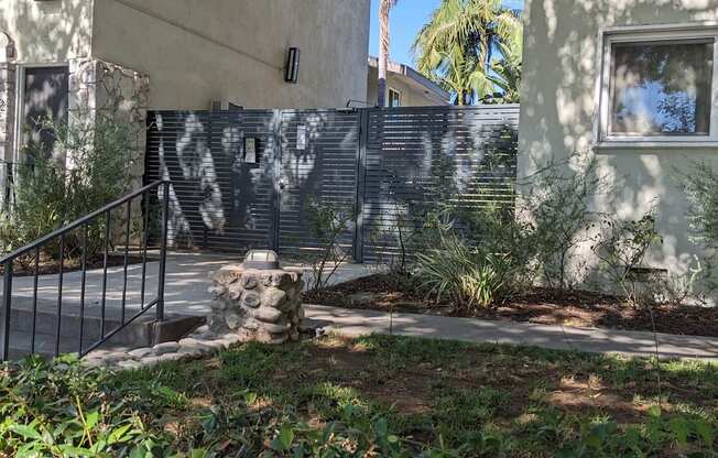 Privacy gate to innear courtyard, pool, and apartment enterances at Los Robles Apartments in Pasadena, California.