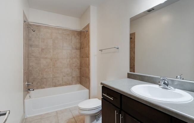 a bathroom with a sink toilet and a shower