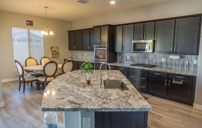 Gorgeous 4 Bed + den Single Level Home in gated community in North Peoria with RV Gate / BBQ!!