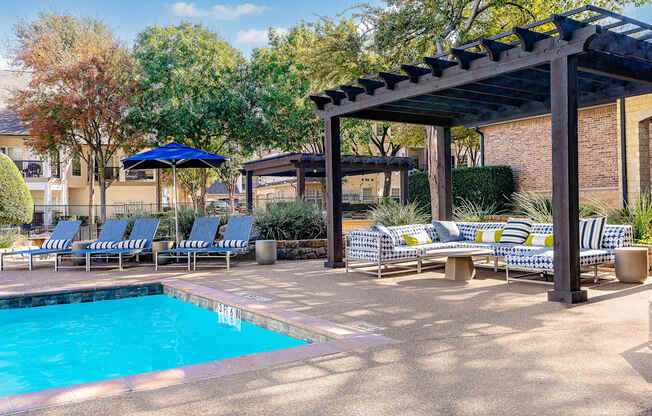 swimming pool with lounge chairs