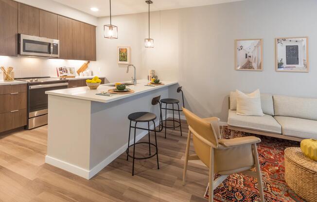 Spacious living room with open concept designer kitchen.
