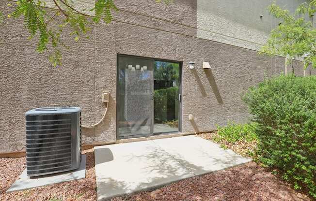 A wall with a window and a door.