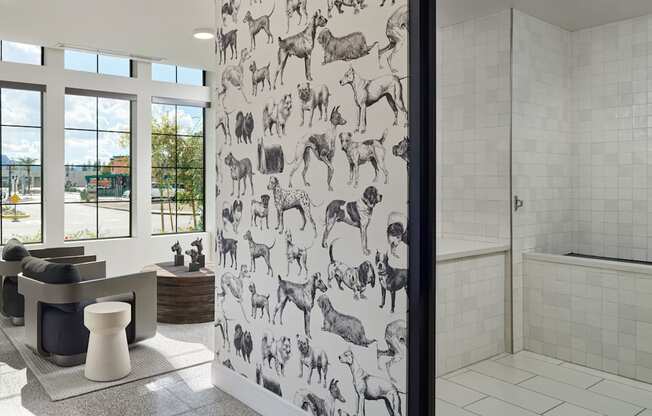 A bathroom with a shower and a sofa.