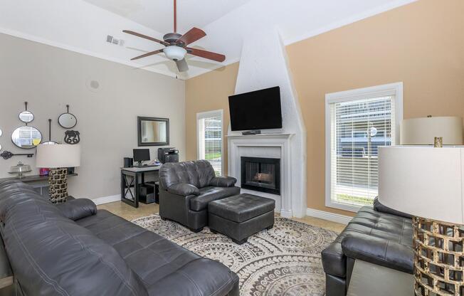 a living room filled with furniture and a tv