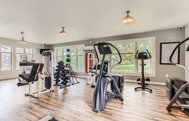 Fairview OR Apartments - Lodges at Lake Salish - Resident Fitness Center WIth Ellipticals, Handweights, and Various Other Exercise Machines and Equipment