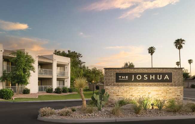 the sign in front of a building with palm trees